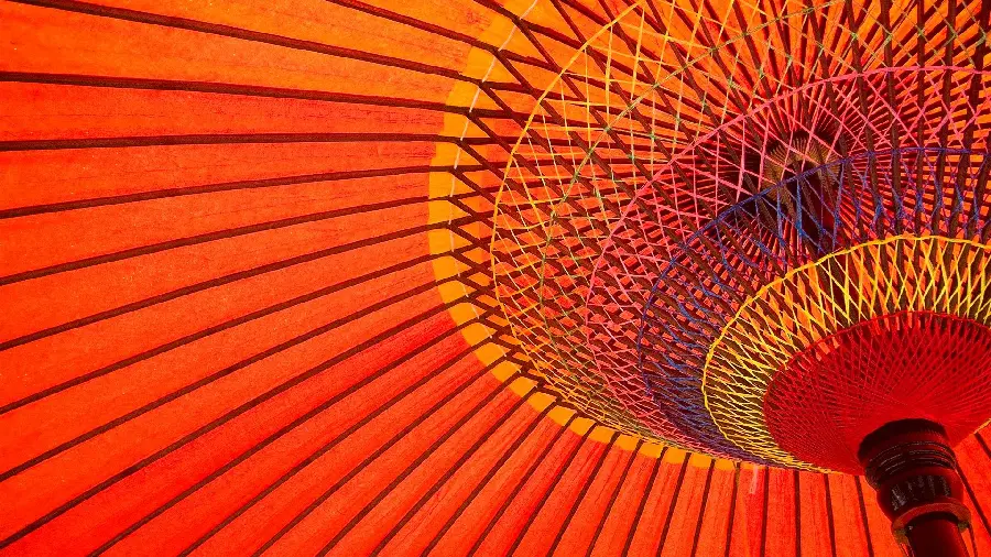 Wallpaper of close-up view of traditional Japanese umbrella in attractive red color