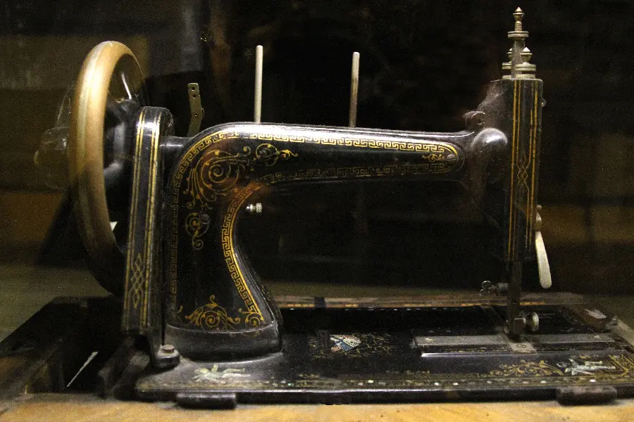 Wallpaper of old and antique handmade and homemade sewing machines 