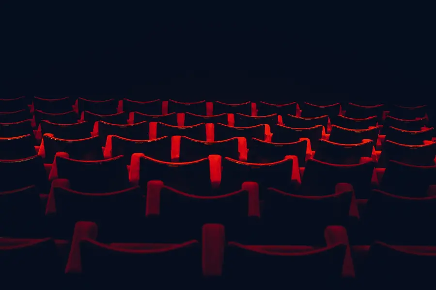 Background for laptop of theater chairs on a dark background