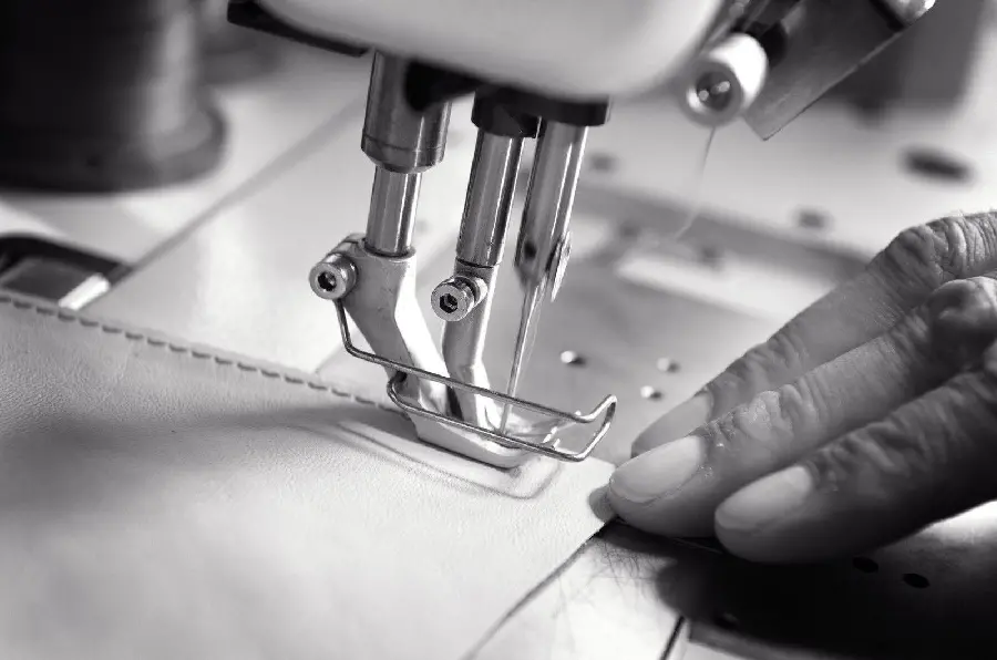 Black and white image of a modern and stylish sewing machine 