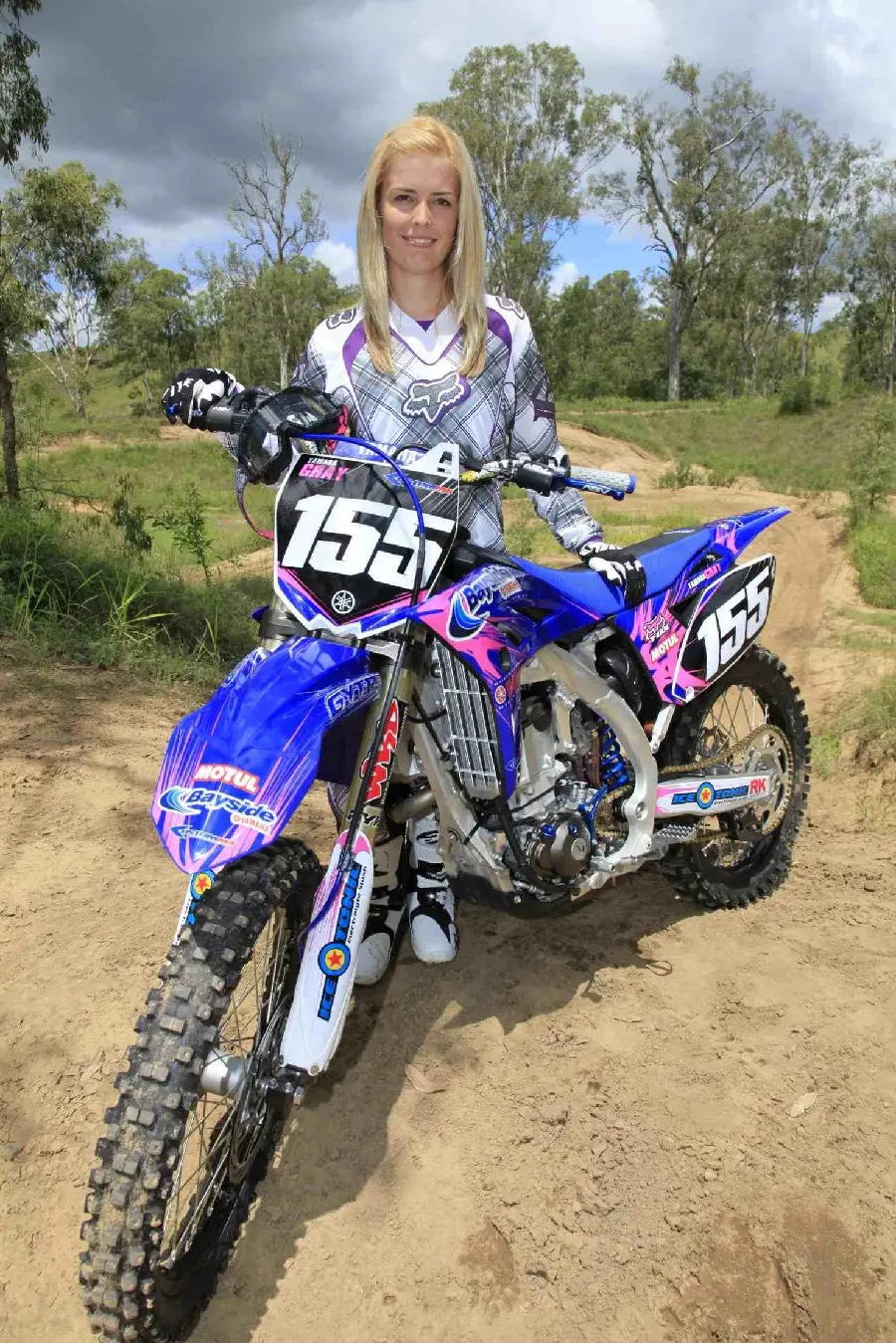 Hot and attractive profile photo of a young girl in motocross competitions