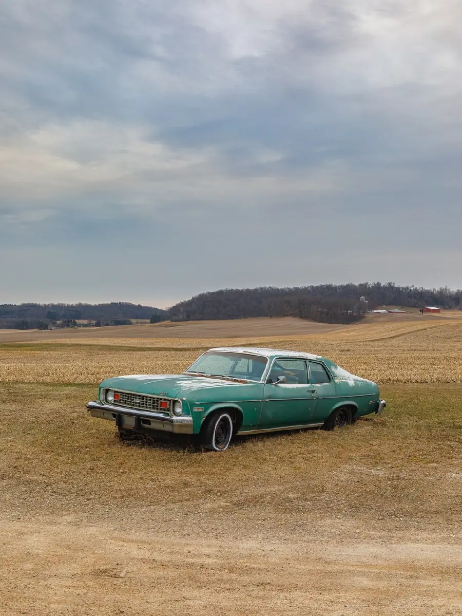 Interesting image of an old car abandoned in nature for the iPhone