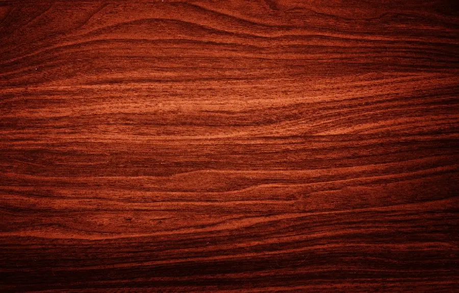 The stunning red or dark brown color and texture of cherry wood and its use in luxury decoration accessories and the wood arts industry such as carving, mosaic and latticework