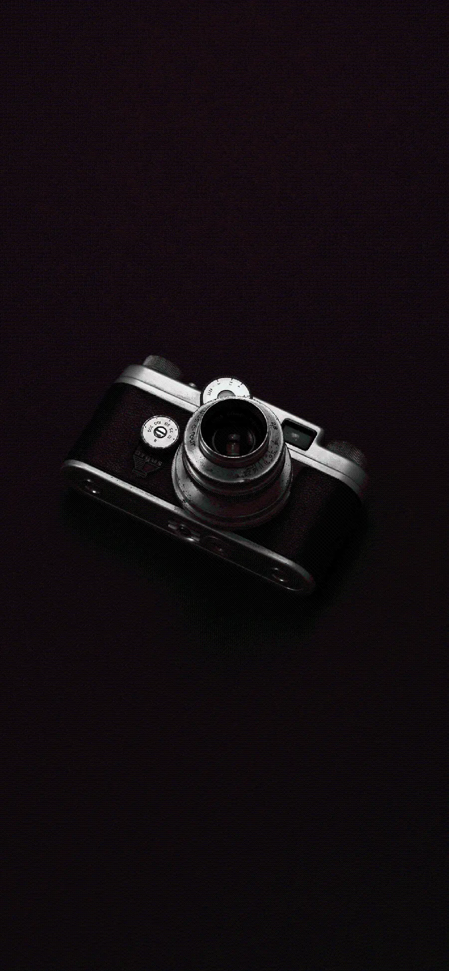 Download stylish and unique photo of a camera with a black background 