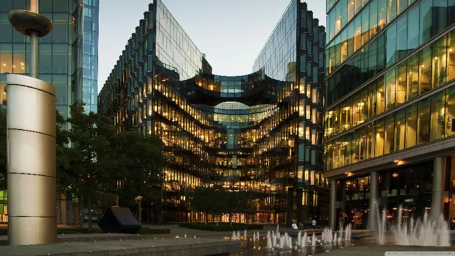 Stock photo of modern glass building London at night 4K HD 