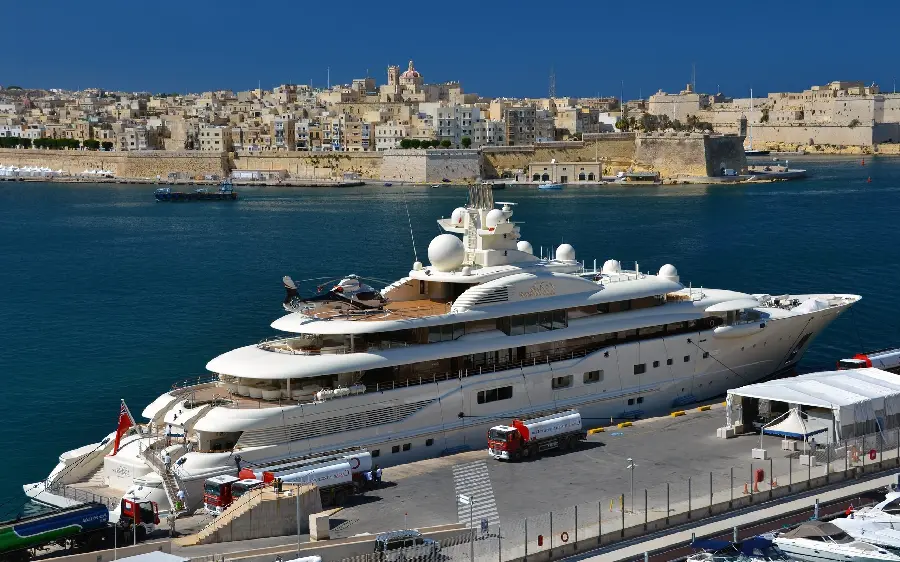 Photo of white and expensive yacht in calm waters