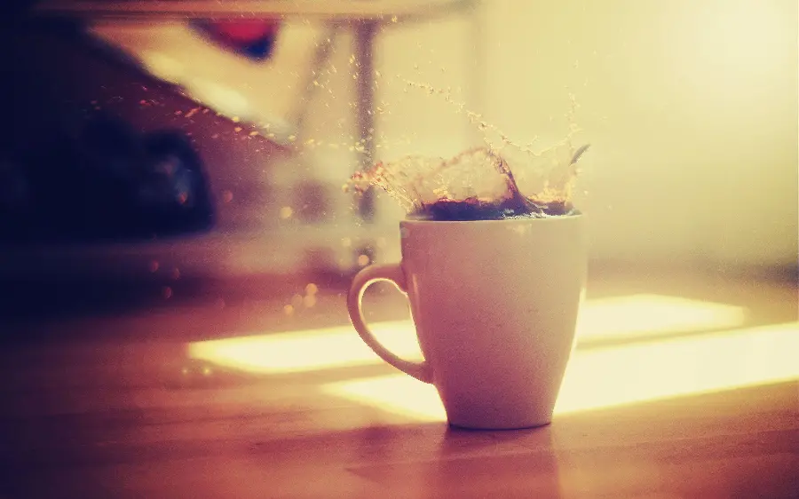 Cover highlight photo of coffee spilling out of white cup