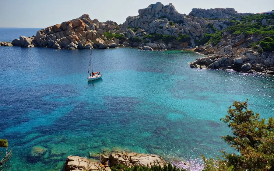 A picture of a sunny and calm day with a mysterious ocean view