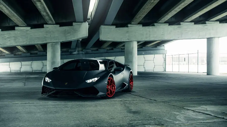 Download free and high-quality image of a black Lamborghini Huracan in the parking lot 