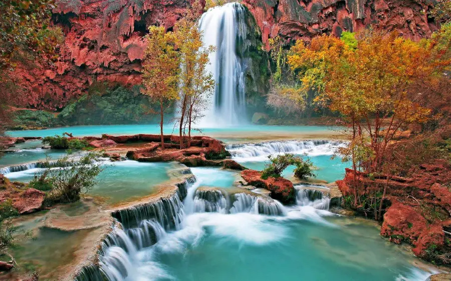 Stock and Full HD image of a waterfall in the autumn forest for printing on a board 