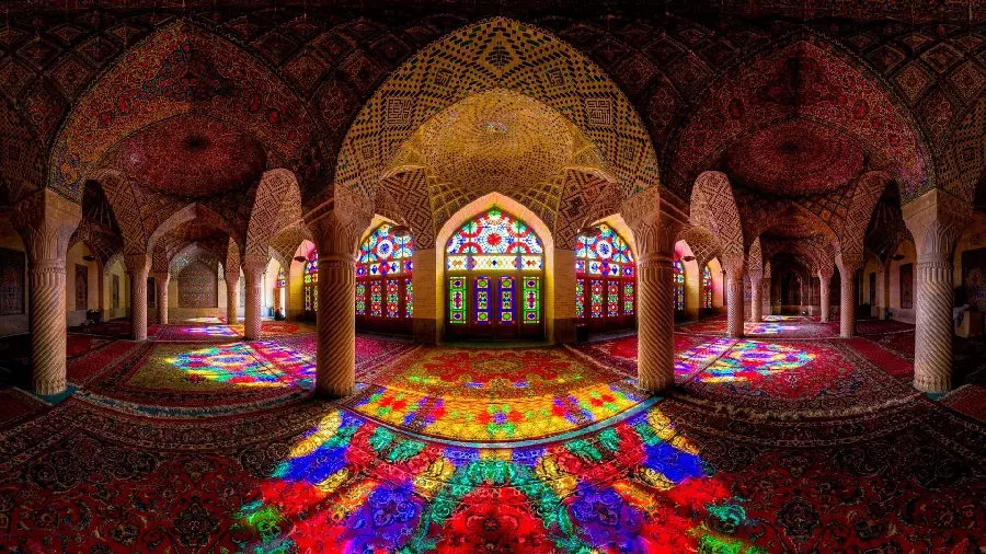 Beautiful photo of Islamic architecture style building with carpeted floor and colored windows