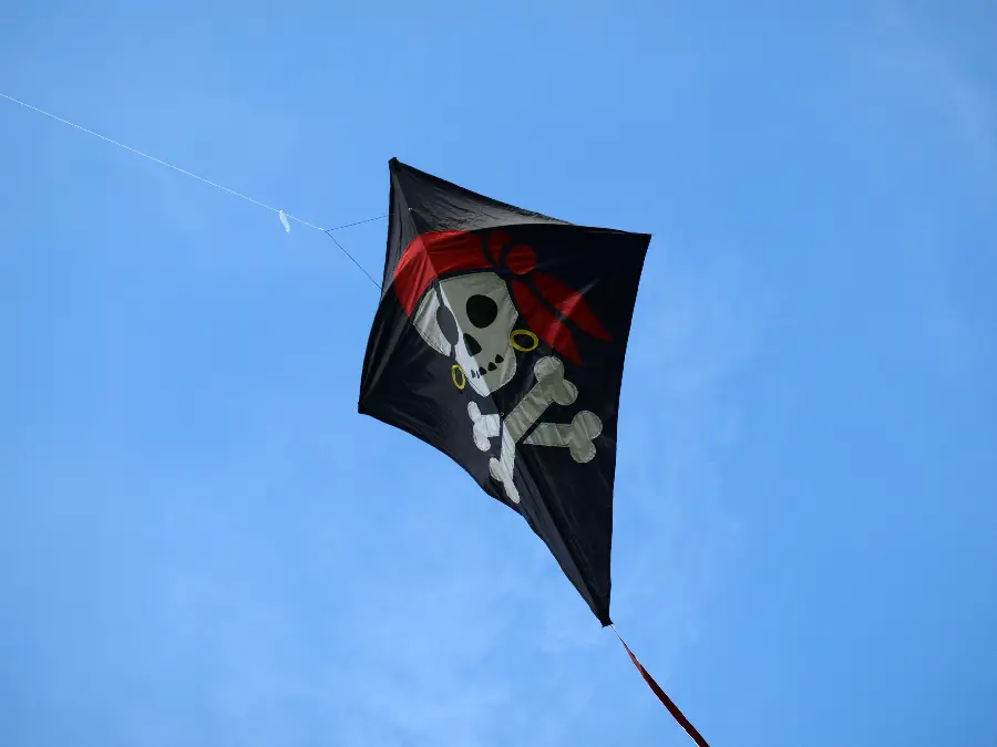 Wallpaper with a special and interesting design of a scary kite with a picture of a pirate skeleton 
