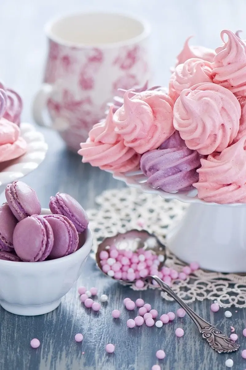 A high-quality photo of a heavenly dessert next to pink macarons