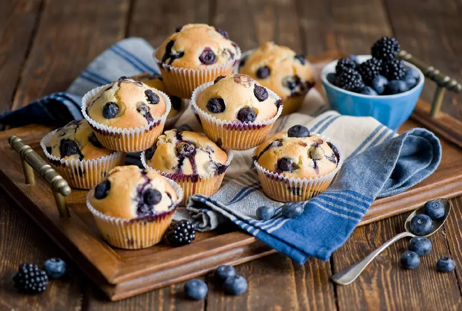 Download photo of delicious and sour blueberry cookies or muffins or cupcakes