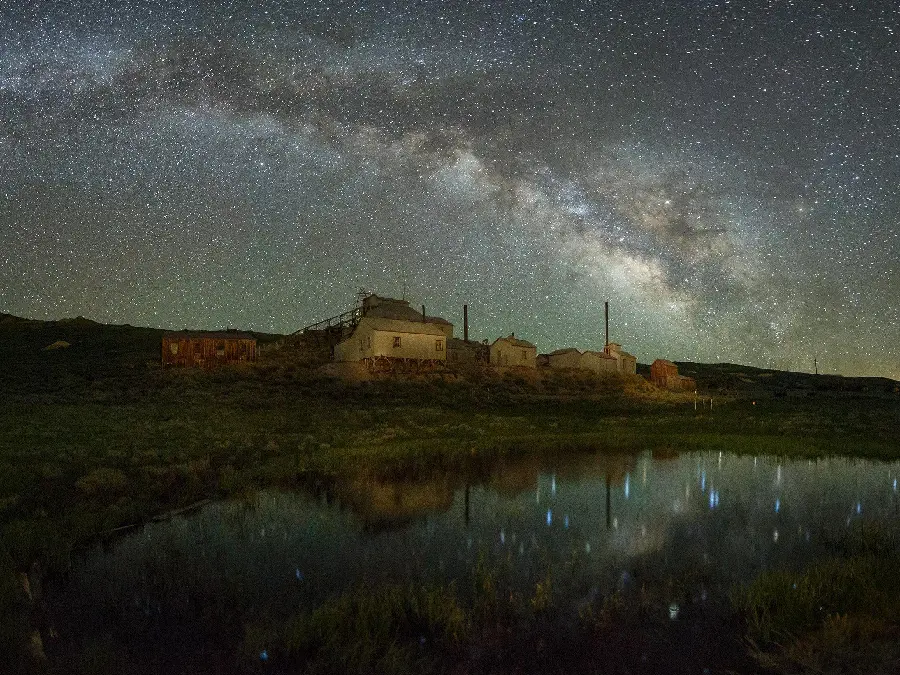 Night photography of the Milky Way reflection in the grass Jeff Sullivan
