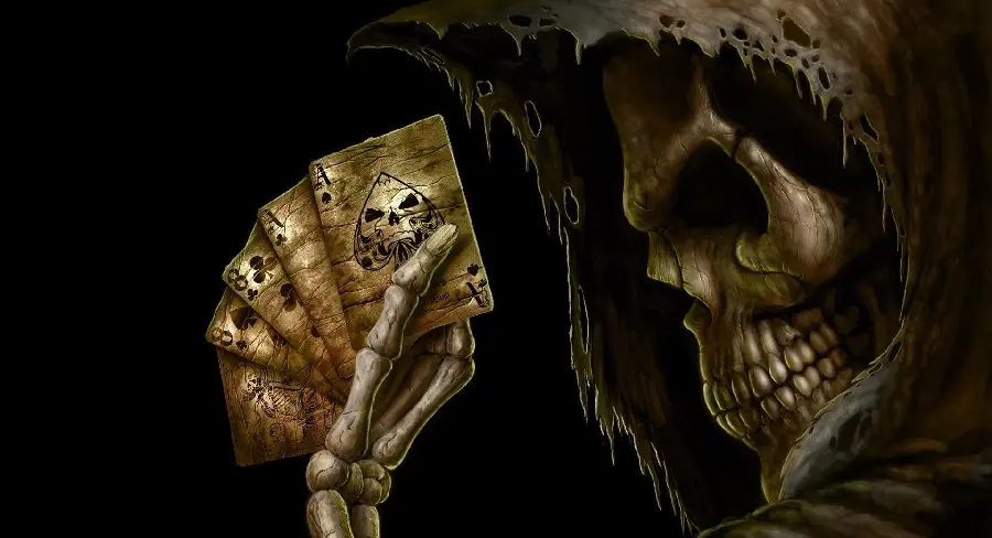 Download a scary photo of a human skull wearing a cape in the shape of a devil