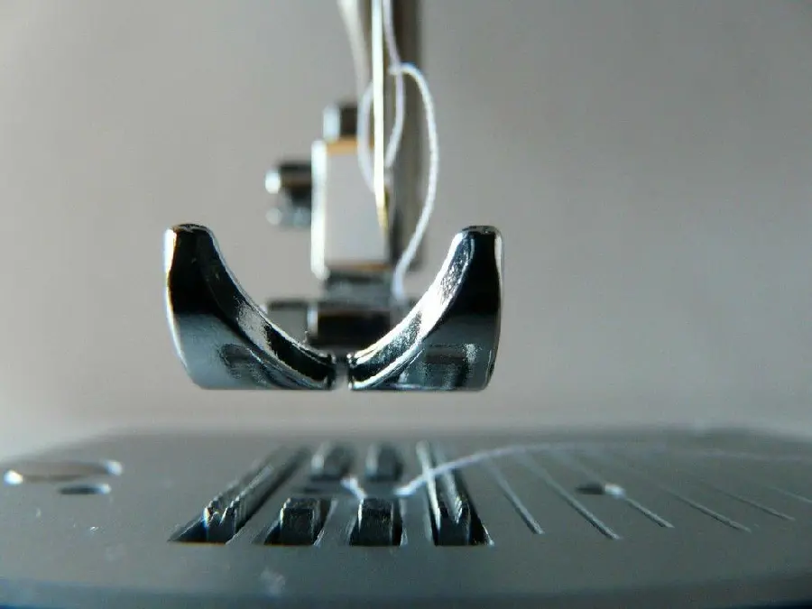 Background of a sewing machine needle from a very close and high quality view