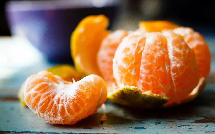 Old and autumnal background image of delicious tangerines