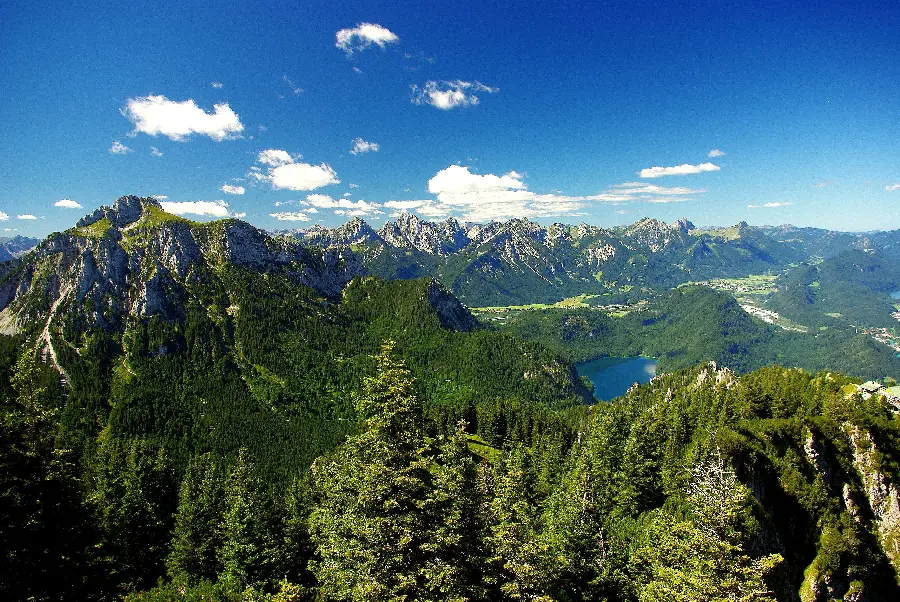 Lush mountainous nature with high mountains and blue sky