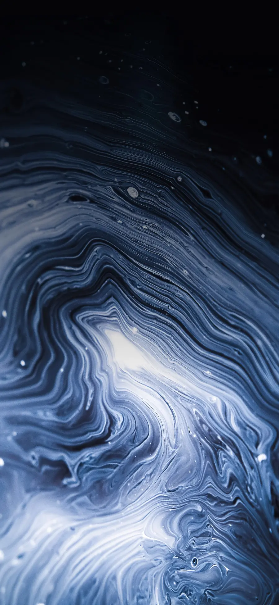 Liquid texture image covered in black background 