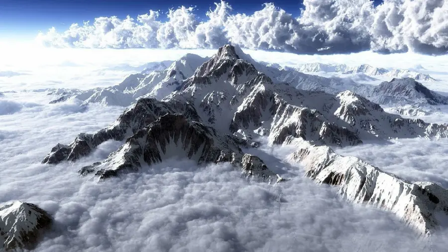 Aerial photo of high peaks and white clouds in mysterious nature