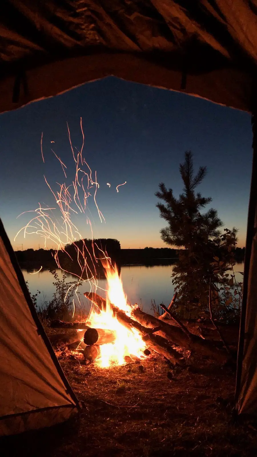 Photo of a camp by the lake for nature lovers