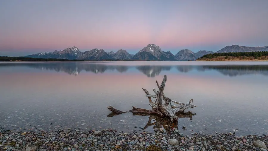 Scenic photo of a pink horizon of a calm lake in the twilight Jeff Sullivan Photography