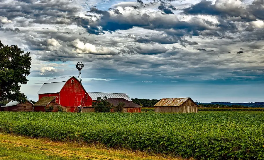 Amazing Stock Photo of a Barn Next to a Cozy Log Cabin
