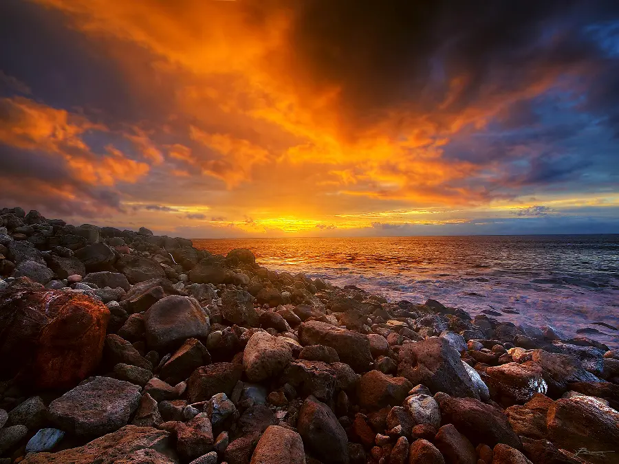 The most mysterious, stylish and romantic dream wallpaper with a sunset view on a rocky beach