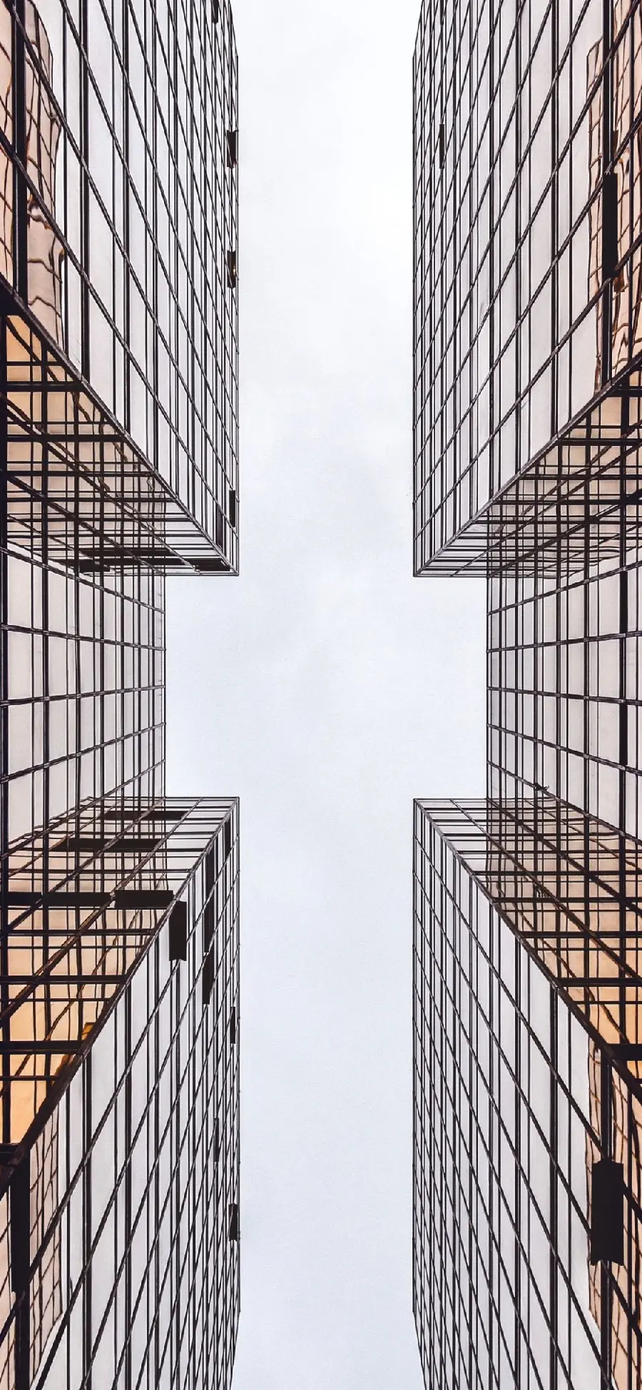 Background of beautiful effect and stylish glass facades of modern buildings 