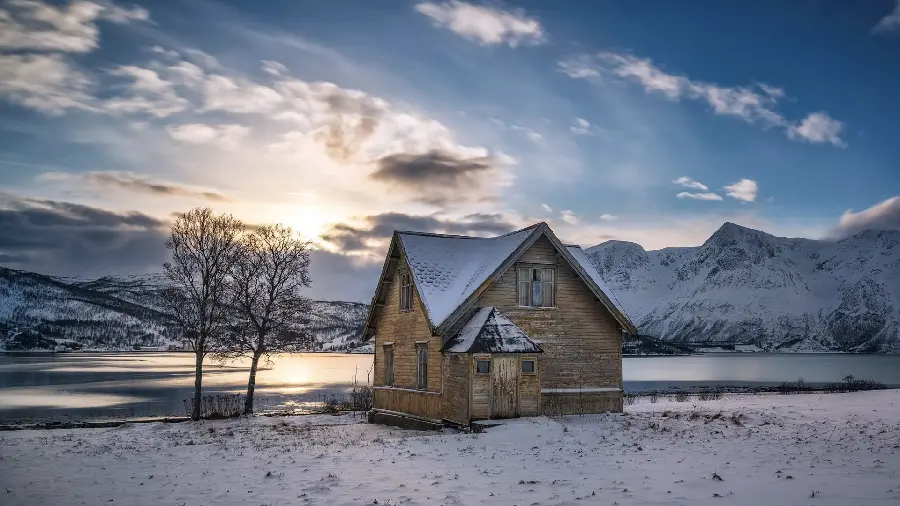 Background of a small wooden house and hut in the forest in winter nature
