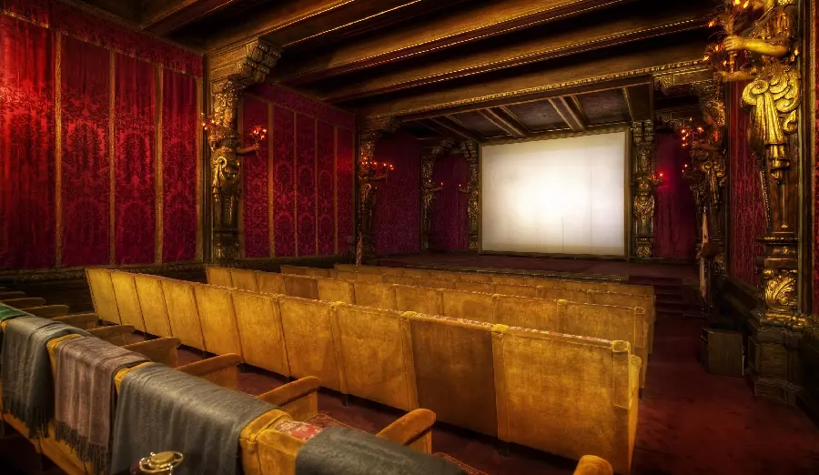 Classic style cinema photo with statue decorations and wooden walls