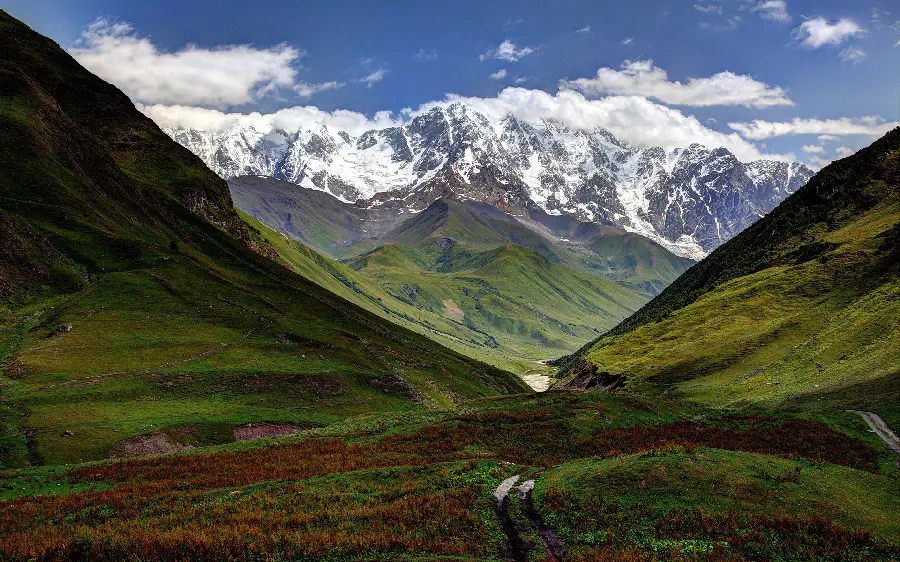 Download photo of natural landscape of high snowy mountains