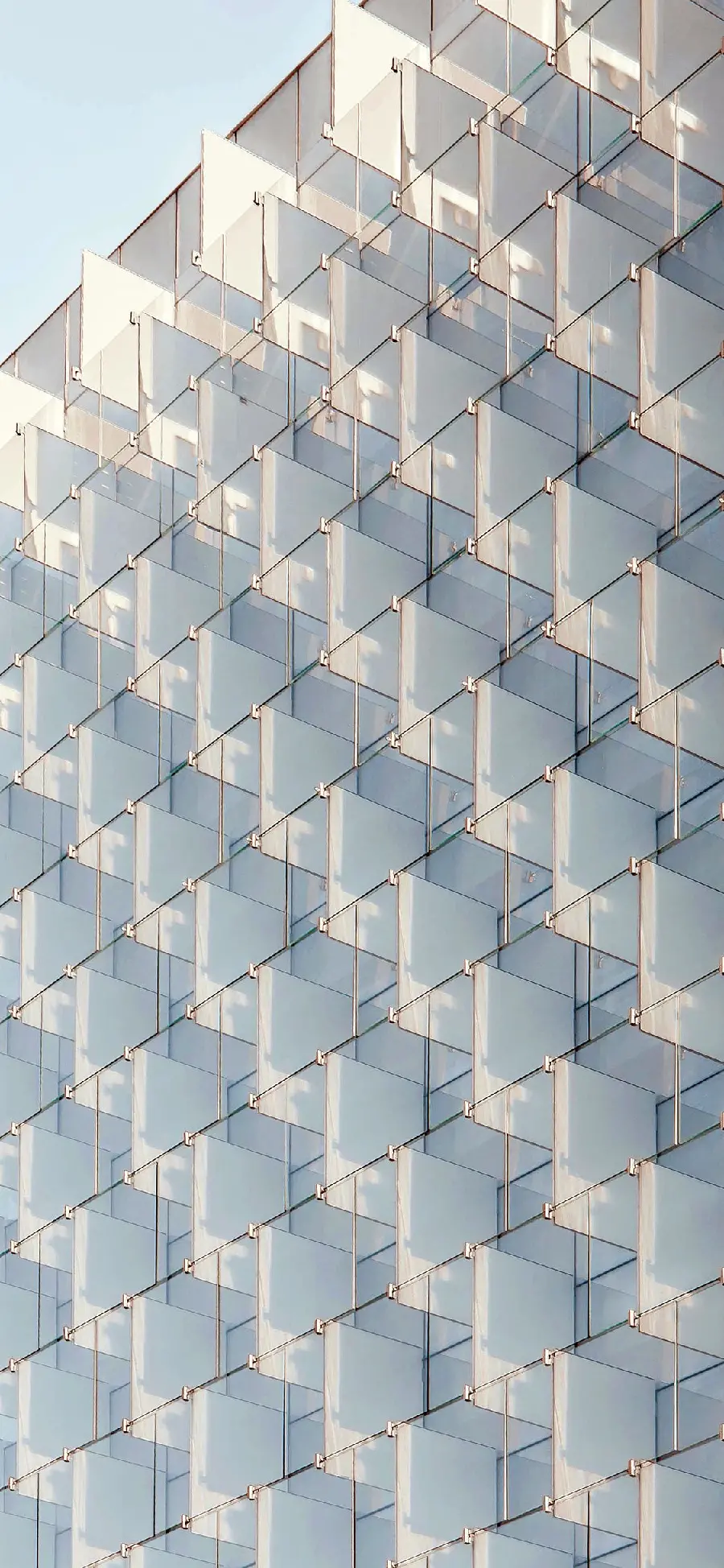 Glass facade of interconnected windows of the exterior space of a modern building