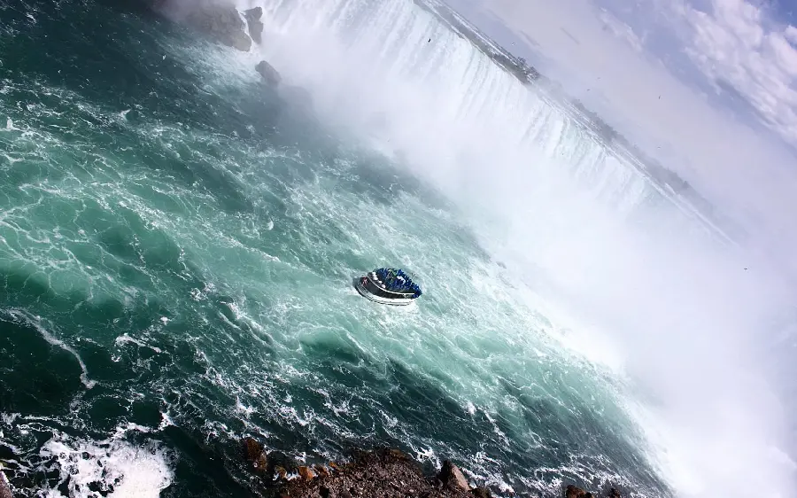 Exciting image of a waterfall and a raging river and angry