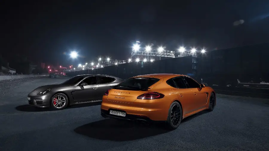 Stylish and attractive photo of a supercar orange and gray Porsche Panamera with high quality HD