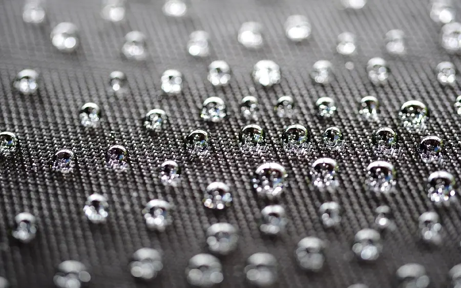 High quality background photo of regular small water droplets on a gray background
