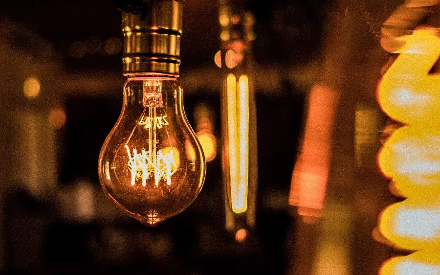 Photo of a bright electric lamp and bulb for the profile and background of electrical engineering students