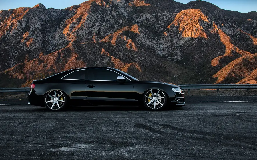 Classy boys' wallpaper of a shiny black Audi luxury car 