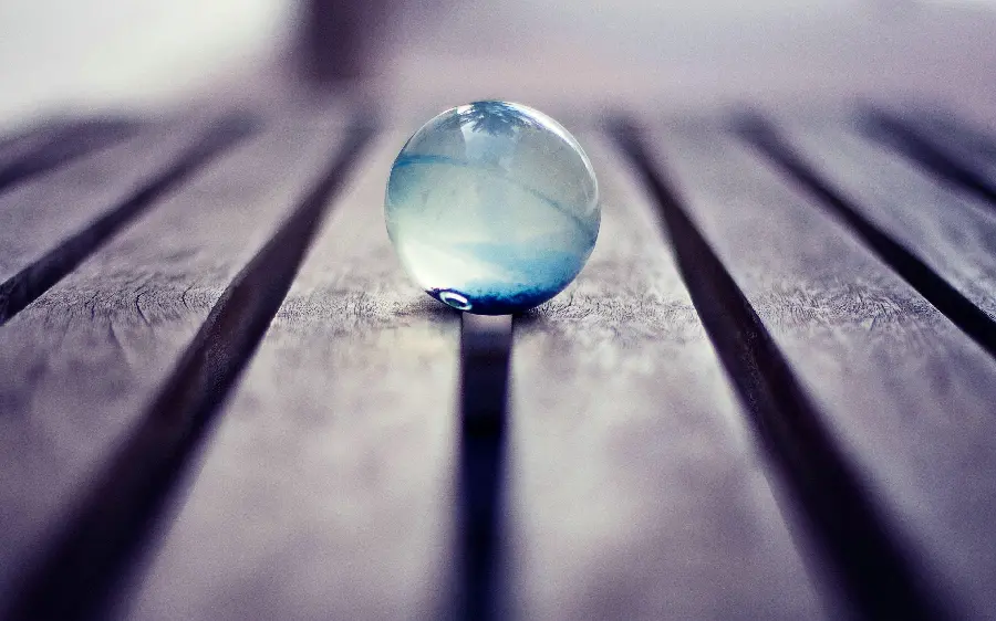 Beautiful and special photo of a small decorative crystal ball on the table 