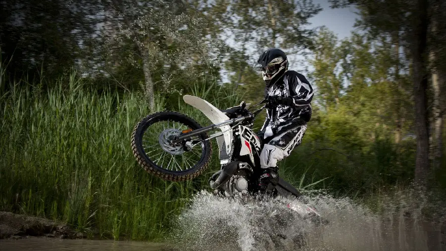 Trail Riding Motorcycle Maneuvering Skills and River Jumping Background