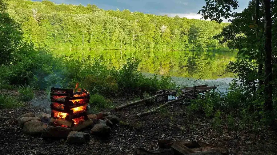 Stock of camping by a unique lake and an old wooden bridge 