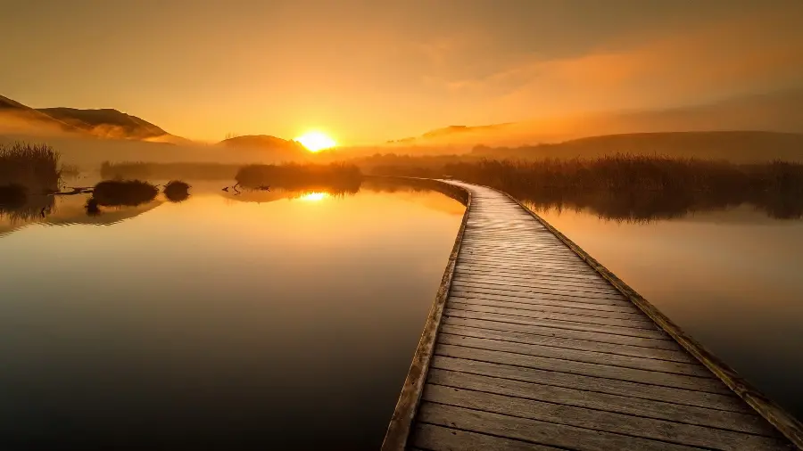 Special background of a dreamy wooden bridge crossing the horizon of a lagoon in HD quality
