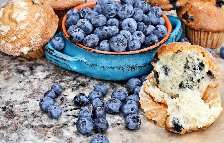 Image of a blueberry muffin being prepared 