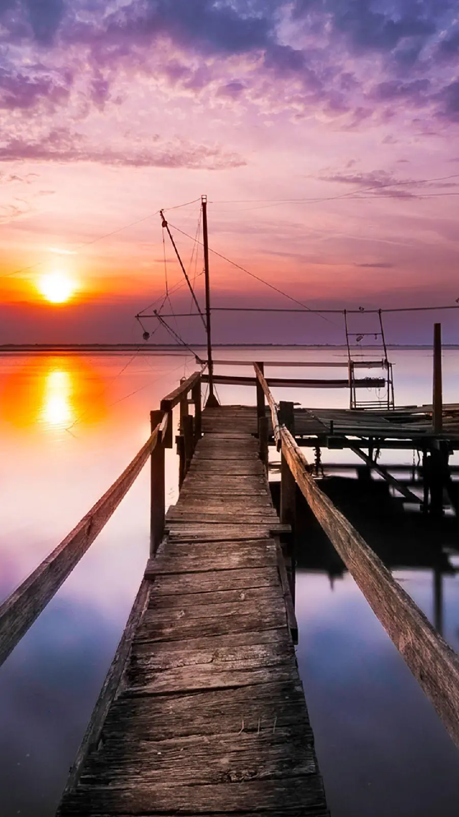 Dreamy image of a landscape of an old wooden bridge