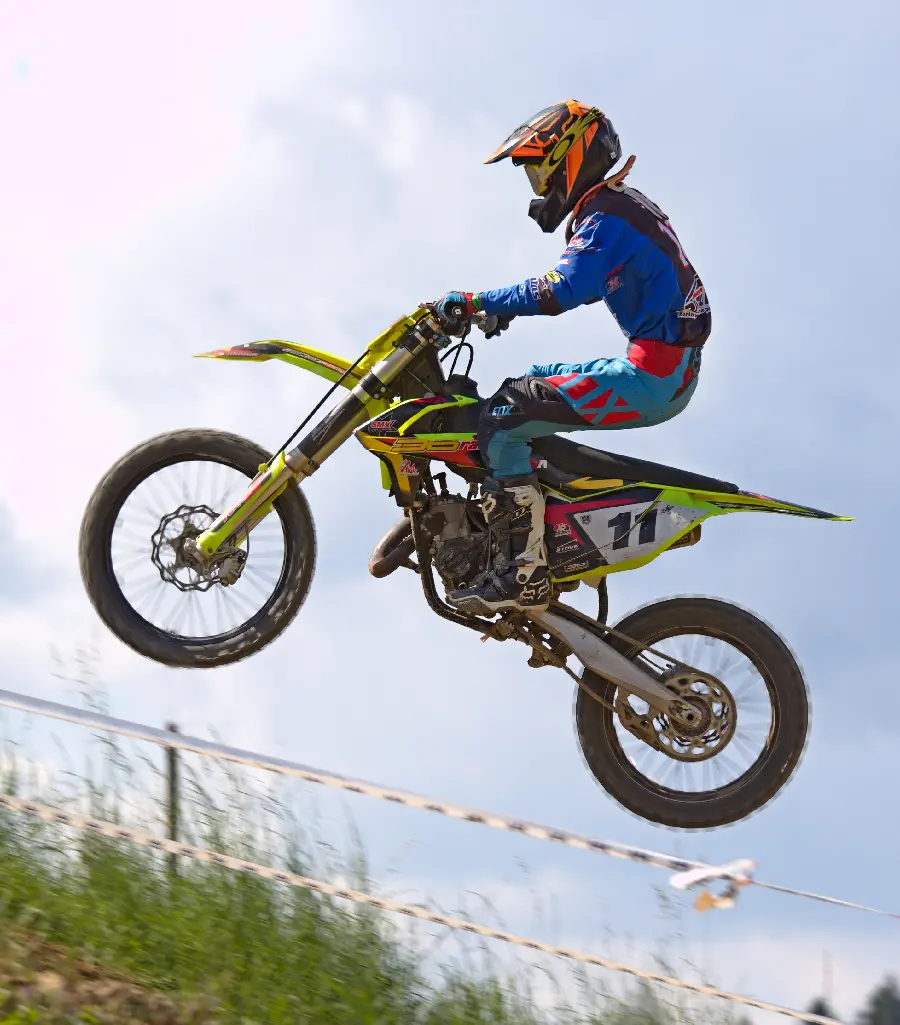 Wallpaper of a motorcycle jump with a cross cross with complete safety 