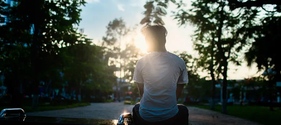 Interesting profile picture of a lonely man next to trees with high quality 