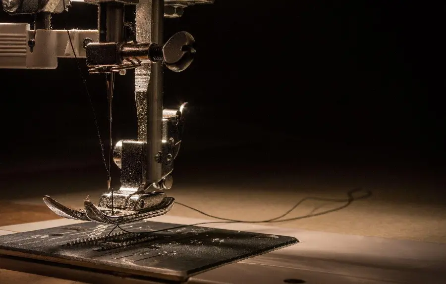 Very close and high-quality view of the sewing machine needle