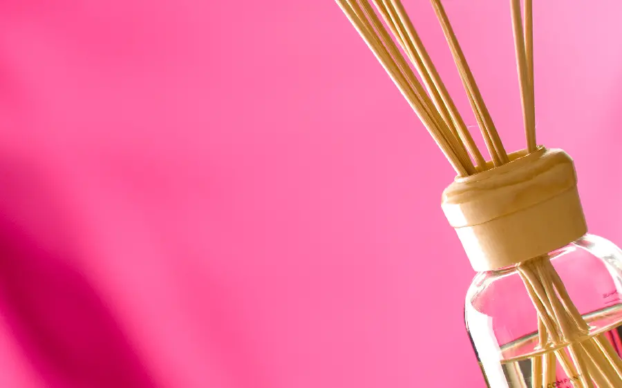Simple photo of a water glass with a pink background for writing text and Instagram posts 