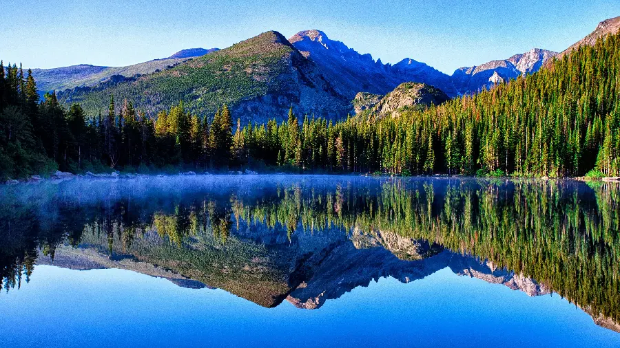 Amazing rare nature image of a mountain lake and forest